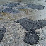 Результат ямочного ремонта в "разгар" дождя на Мира 12-14.